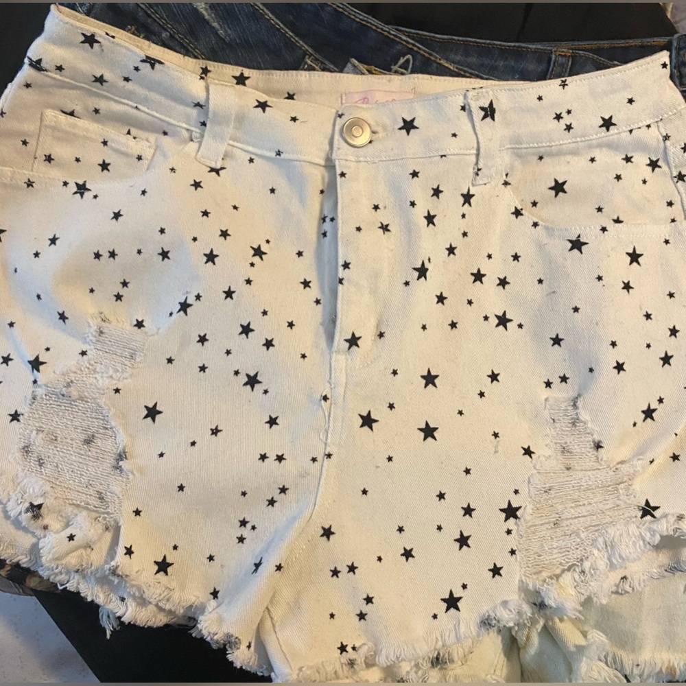 Pinklily.com Boutique white with black stars denim distressed shorts.